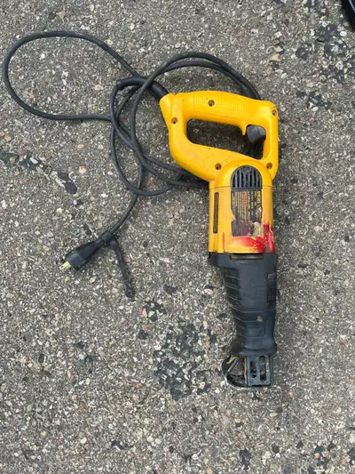 This is a used DeWalt reciprocating saw, ready to tackle your toughest cutting jobs with its robust...
