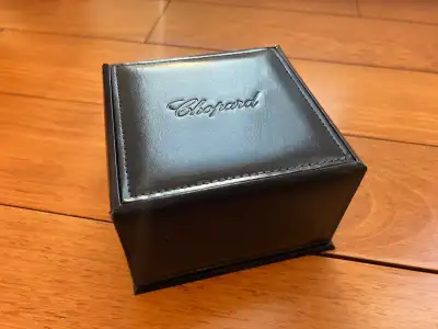 An authentic and hard to find Chopard Watch box in blue leather with outer box and white card board...