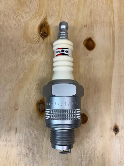 Champion Spark Plug AM/FM transistor radio in new condition and sold as shown in photos. Tested and...