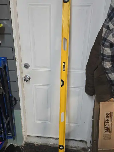 This is a used DeWalt 72-inch level, perfect for ensuring your projects are perfectly aligned! It's...