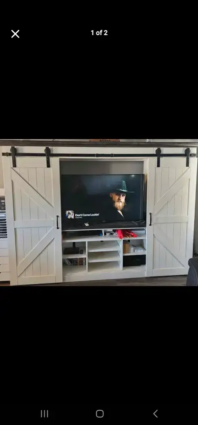 four-piece entertainment unit, farmhouse style with double barn doors to reveal extra storage space...