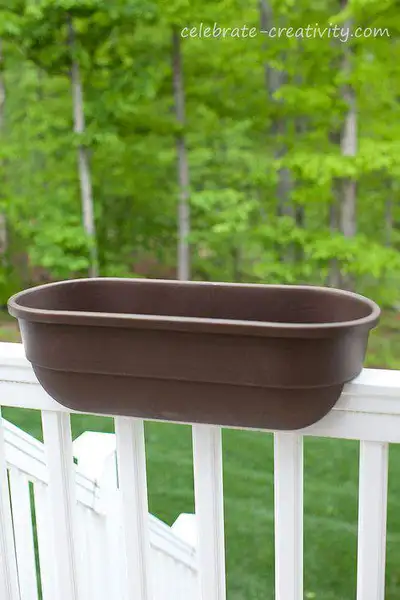 Deck rail flower box. New unused. Brown plastic. Fits standard 2x4 and 2x6 railings. ~ 24L X 12W X 1...