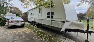 Outback 28RSS in great shape! Rear manual slide out queen bed. Side powered slide with couch that co...