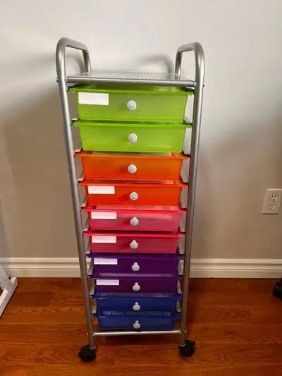 This pre-owned Sterilite 10-drawer rolling storage cart features a sturdy metal frame and vibrant mu...