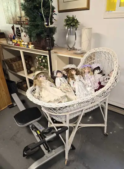White wicker bassinet. Free porcelain dolls come with the bassinette. Smoke free home. Pick up in Fo...