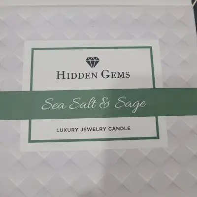 I am offering for sale a brand new Hidden Gems: Three Wick Sea Salt & Sage Candle w/ 1 Ring Inside....