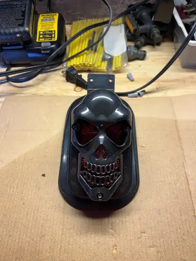 Brand new motorcycle black skull tail light new never hooked up
