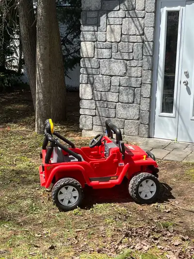 Lightly used like new radio is functioning, 2 seater ride in car with battery and charger included ....