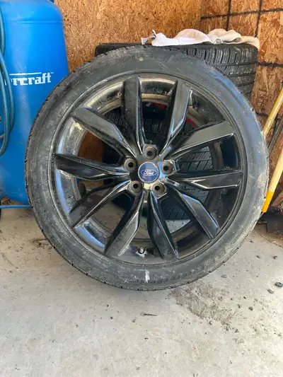 235/45 R19 95H BF Goodrich Advantage All Season on Ford factory blackout aluminum rims. Rims in exce...