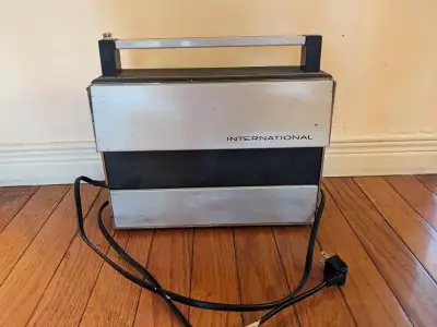 Vintage International Solid State 18 Portable Radio, View more
