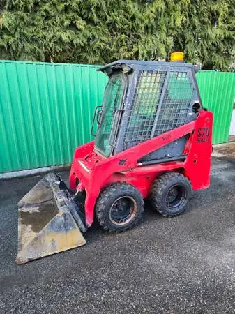 2012 bobcat s70 with 2200hrs. enclosed cab with heat. manual coupler. auxiliary hydraulics. foot con...