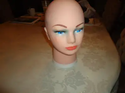 Manoquin head could be used for wig display or to practice hair styling. It is 12 inches high. For s...