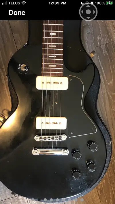 I'm selling a used 1999 Gibson Les Paul Special guitar, a rock and roll workhorse with a sleek black...