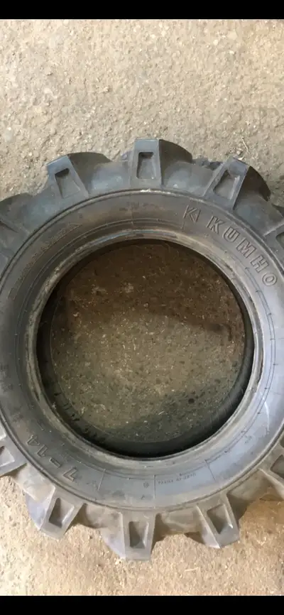 Agricultural Tractor Tire is new never drove on. 7 inches wide fits on 14 inch rim.