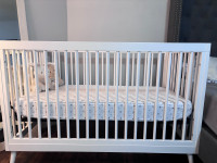 Crib with Mattress and blue hanging toy