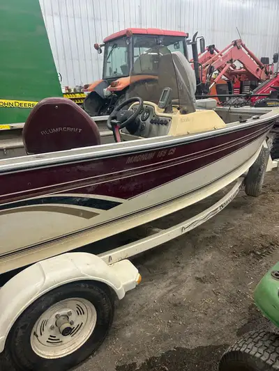 Alumacraft Magnum 165 CS fishing boat with a 60 horse two-stroke oil injected mercury motor comes wi...