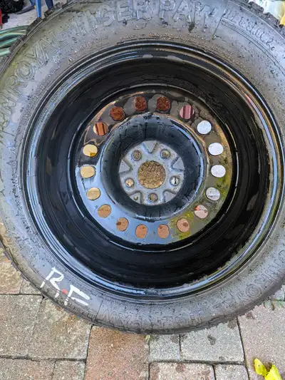 These Uniroyal Tiger Paw winter tires are sized 215/60R17 and are currently mounted on steel rims. A...