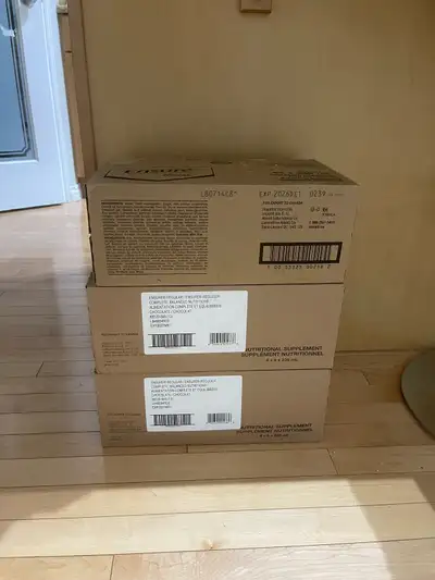 Selling three regular chocolate Ensure drink 24 pack boxes. Two Expire on March 2027 and one on Dece...