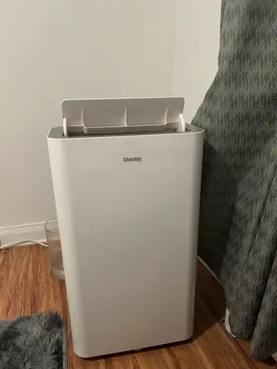 Stay cool this summer with this Danby Portable Air Conditioner, model DPA120B9WDB. This unit is used...