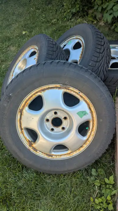 For sale is a set of Uniroyal Tiger Paw Ice & Snow 3 Snow/Winter Tires on original Honda steel rims....