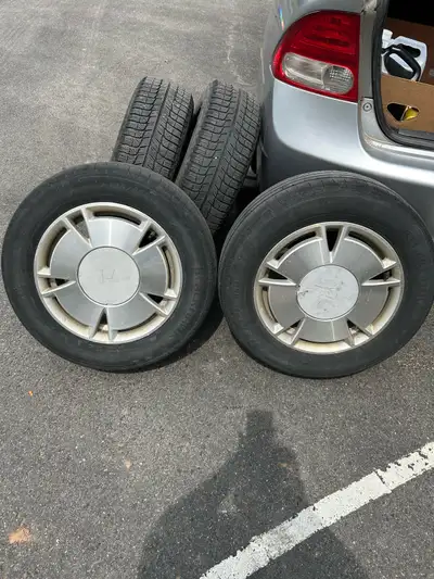 Two honda civic rims and tires 15” for sale 100.00 OBO Two metal rims and tires 15” for sale 100.00...