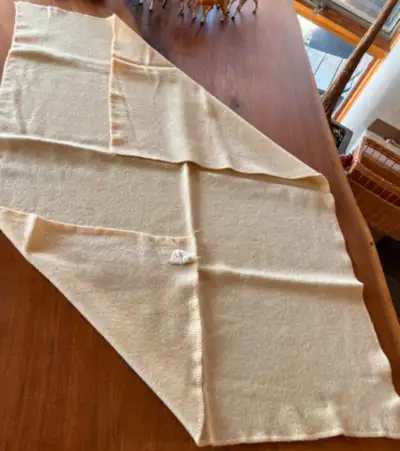 I have two small vintage wool blankets and another of indeterminate fabric. They were each professio...