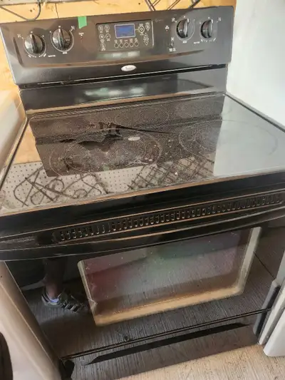 Black ceramic top self cleaning electric stove , View more