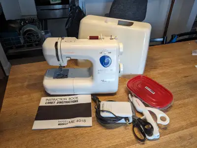 Comes complete with all original parts, includes manual, pinking shears, electric scissors and box o...