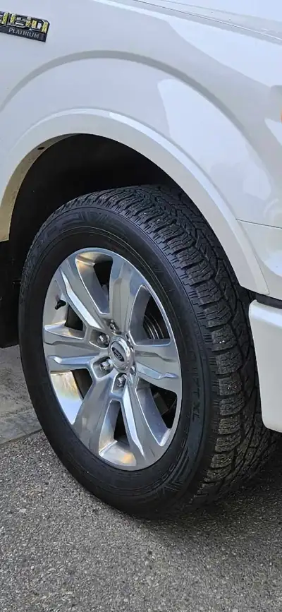 4 stock ford platinum rims with Nokian rotiiva AT tires 275/55R20. 75 percent tread left. Approx 20,...