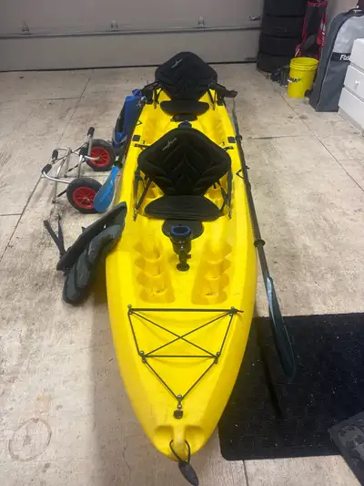 Tandem Kayak with accessories shown including two cup holders, two fishing rod holders, premium oars...