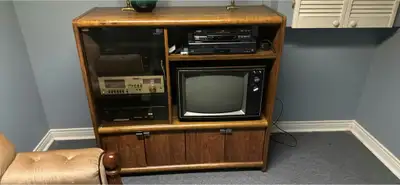 Vintage wooden media cabinet with CRT TV, blue upholstered recl, View more