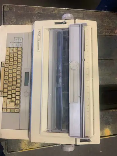 This is a used Xerox 6015 Memorywriter Electronic Typewriter that's perfect for adding a vintage tou...