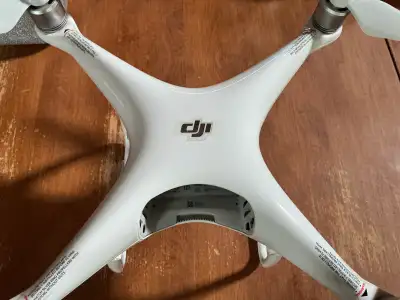 DJI phantom 4 pro drone, comes with foam case, 4 extra propellers, 3 batteries, charger, very nice d...
