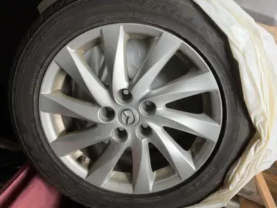 Mazda rims. 5 bolt with M+S41215/55R17、1941 Good Year Eagle Sport tires. The tires are older, not su...