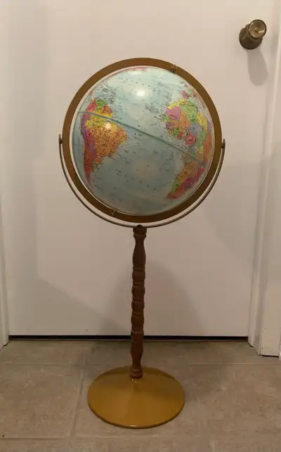 This pre-owned world globe features a detailed map on a classic decorative pedestal stand, measuring...