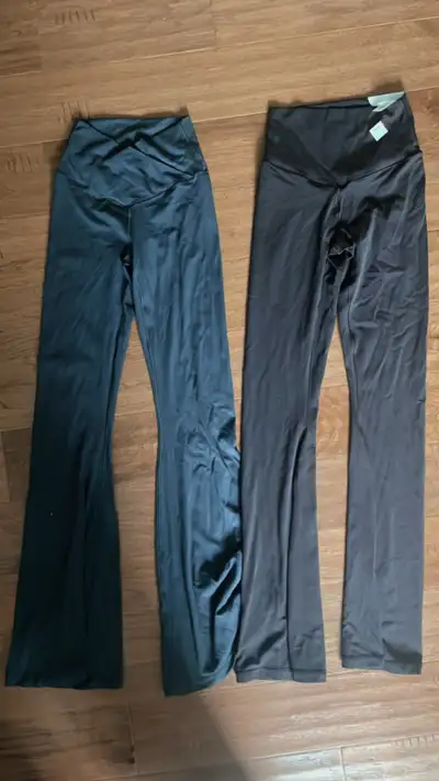 Both size S, one is dark brown and the other is a blueish grey. Brown one still has tags on it, grey...