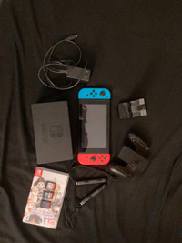 Selling Nintendo Switch with Games and Accessories.