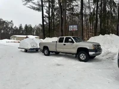 Enclosed snowmobile trailer, only reason I’m selling is it isn’t long enough to cover my girlfriend’...