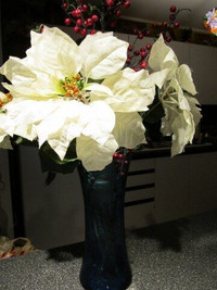 Assorted silk flowers arrangements for holiday season.