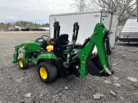 John deere 1026r tractor with all the implements 