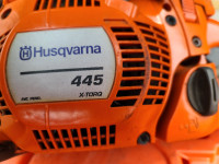 Husqvarna 445 high torque chain saw with case and file like new.