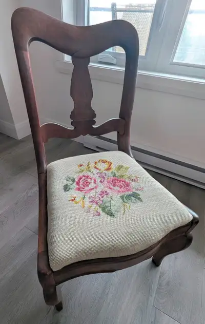 Antique Victorian style chair with a needlepoint or embroidered tapestry upholstery in a floral patt...