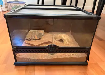 Only used for a few months. No warping or rust. 18x18x12 inch Exoterra. Comes with sand, rocks, hide...