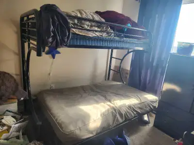 In decent shape. Top bunk is a twin mattress, bottom is a double futon. Futon can be folded up into...