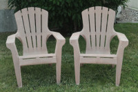 Two Plastic stacking Lawn Chairs