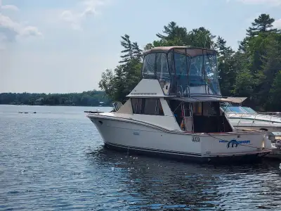 This 1974 Trojan has undergone an extensive restoration. Custom teak exterior trim and hand rails. B...