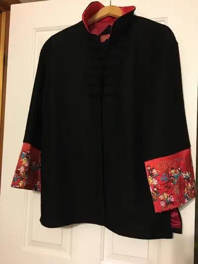 Ladies black dress jacket with theme sleeves., View more