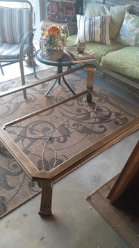 Glass coffee table with one end table.