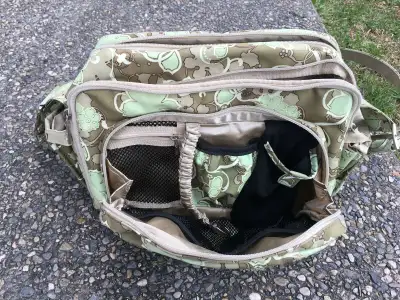 Older model Jujube diaper bag, messenger bag style. Compact, 12” x 8” x 6”, but can fit all the esse...