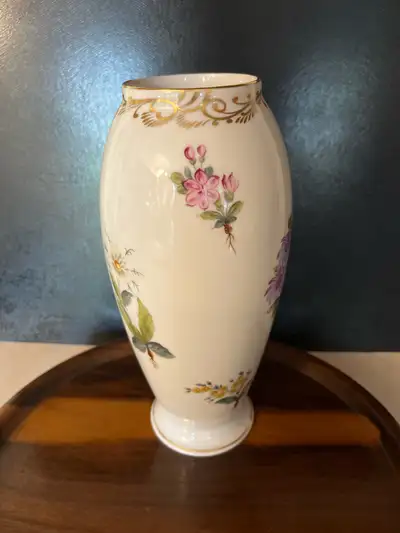 This is a used Herend Hungary porcelain vase, a delightful piece showcasing delicate floral designs...